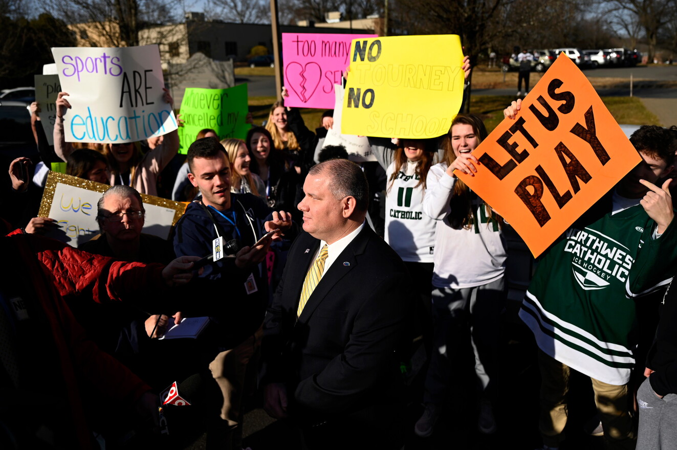 In this file photo from March 2020, CIAC Director Glenn Lungarini is surrounded by students during an interview as hundreds of high school student-athletes, parents and coaches protest the cancellation of the spring season.
